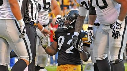 Steelers' LB James Harrison asks a referee why he was called for a roughing penalty on Raiders' QB Jason Campbell in a game at Heinz Field earliert this month.