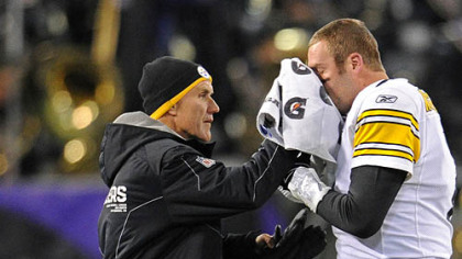 Steelers head trainer John Norwig stops the bleeding on Roethlisberger's broken nose during Sunday's game at M&T Bank Stadium in Baltimore.